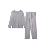 A two-piece light gray loungewear set consisting of a long-sleeve henley-style top and matching straight-leg pants, displayed on a solid white background.