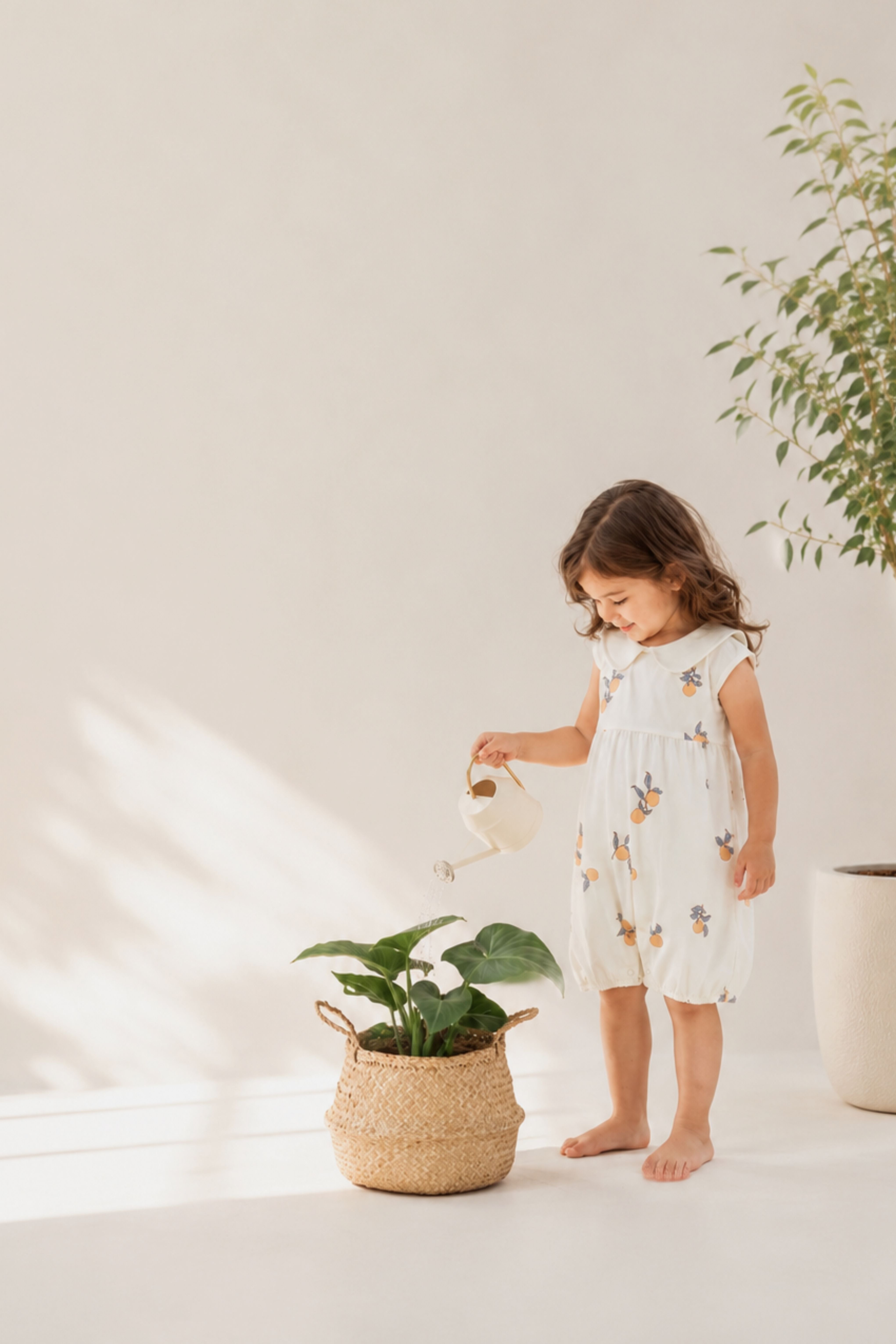 Child watering a plant in a minimalistic indoor setting