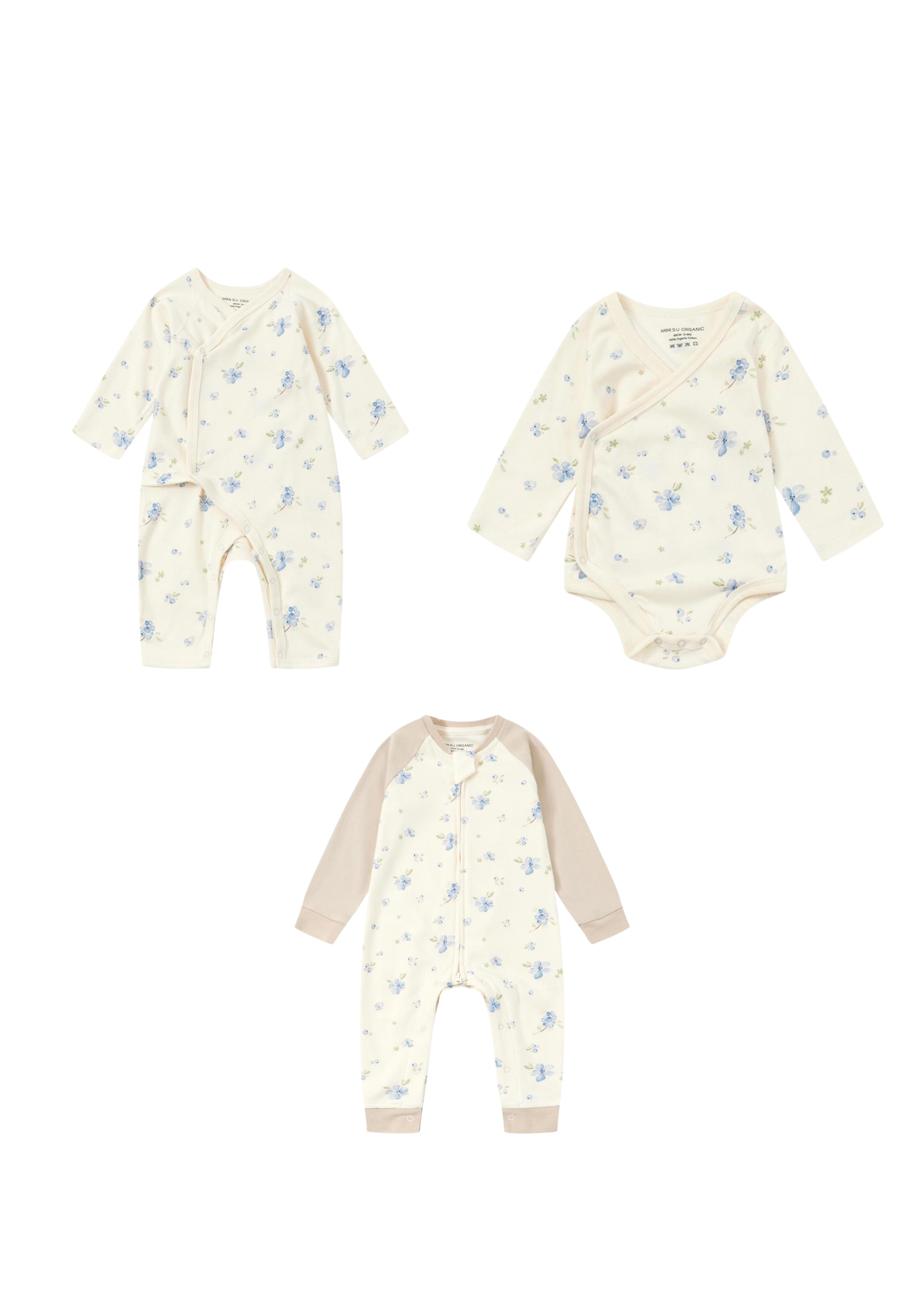 Baby clothing set with onesie, romper, and bodysuits on a white background