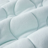 Close-up of a textured light blue fabric surface