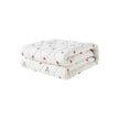 Folded white blanket with red patterns on a white background