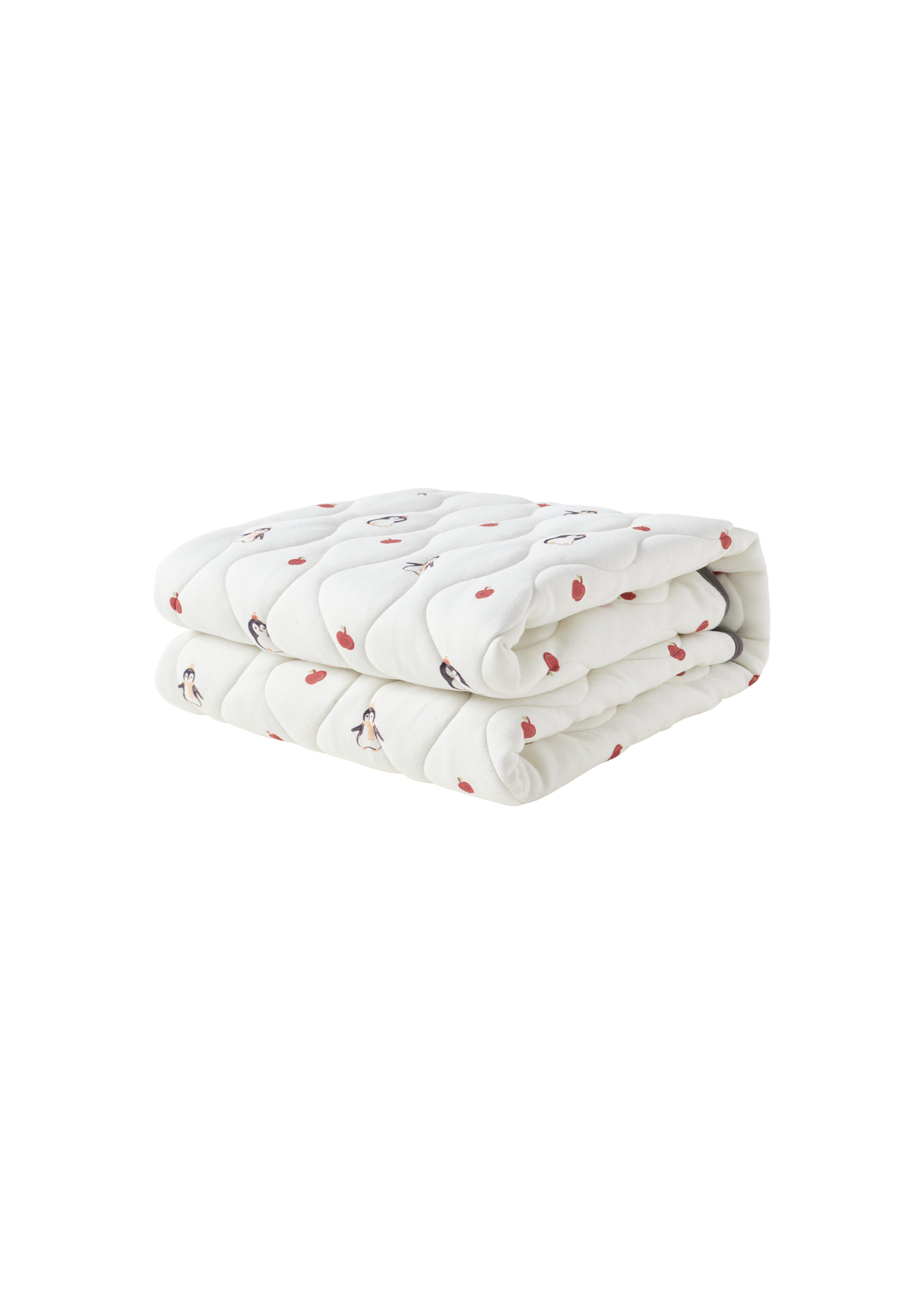 Folded white blanket with red patterns on a white background