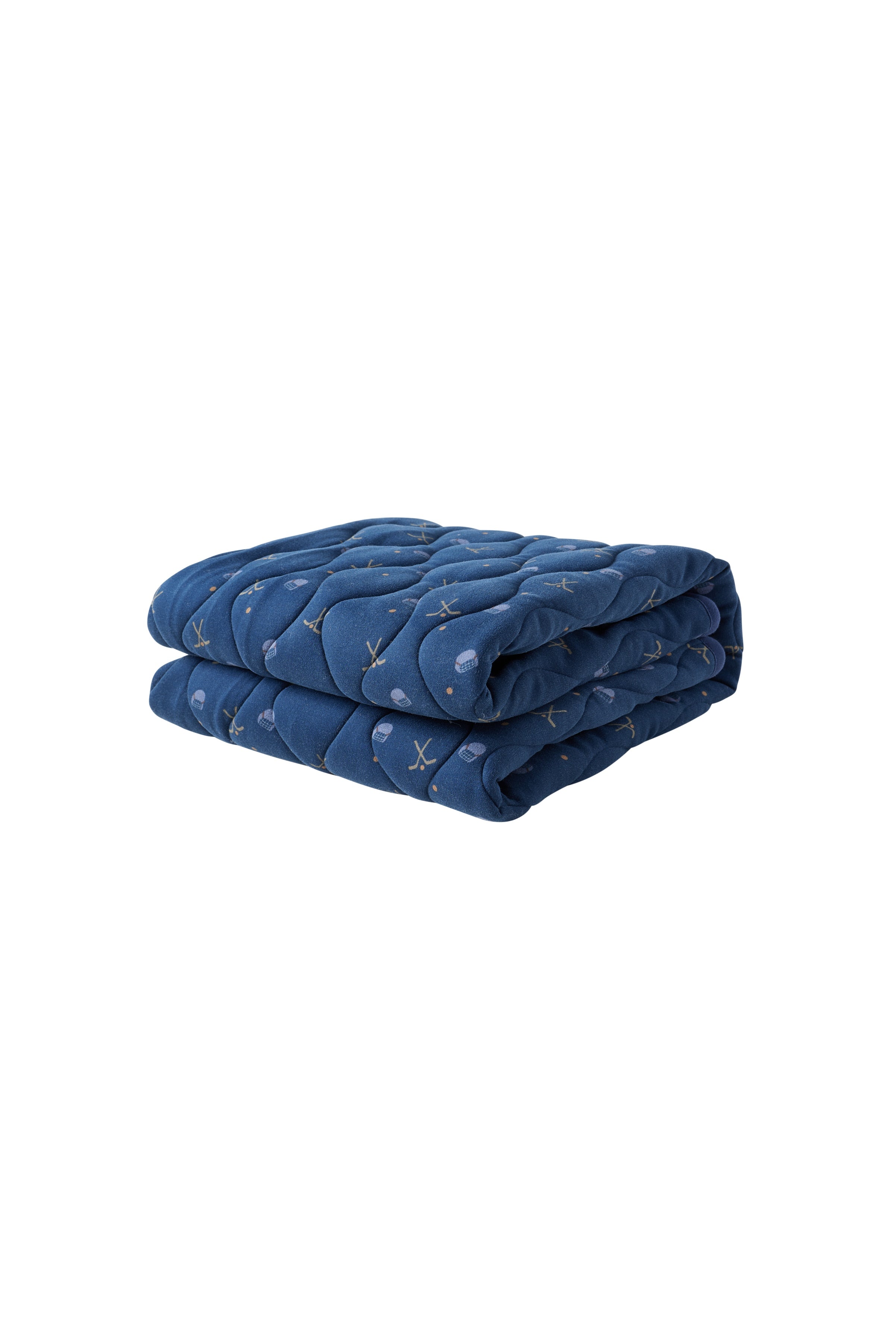 Folded blue quilt with a subtle pattern on a white background