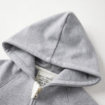 Gray hoodie with a brand label on a white background