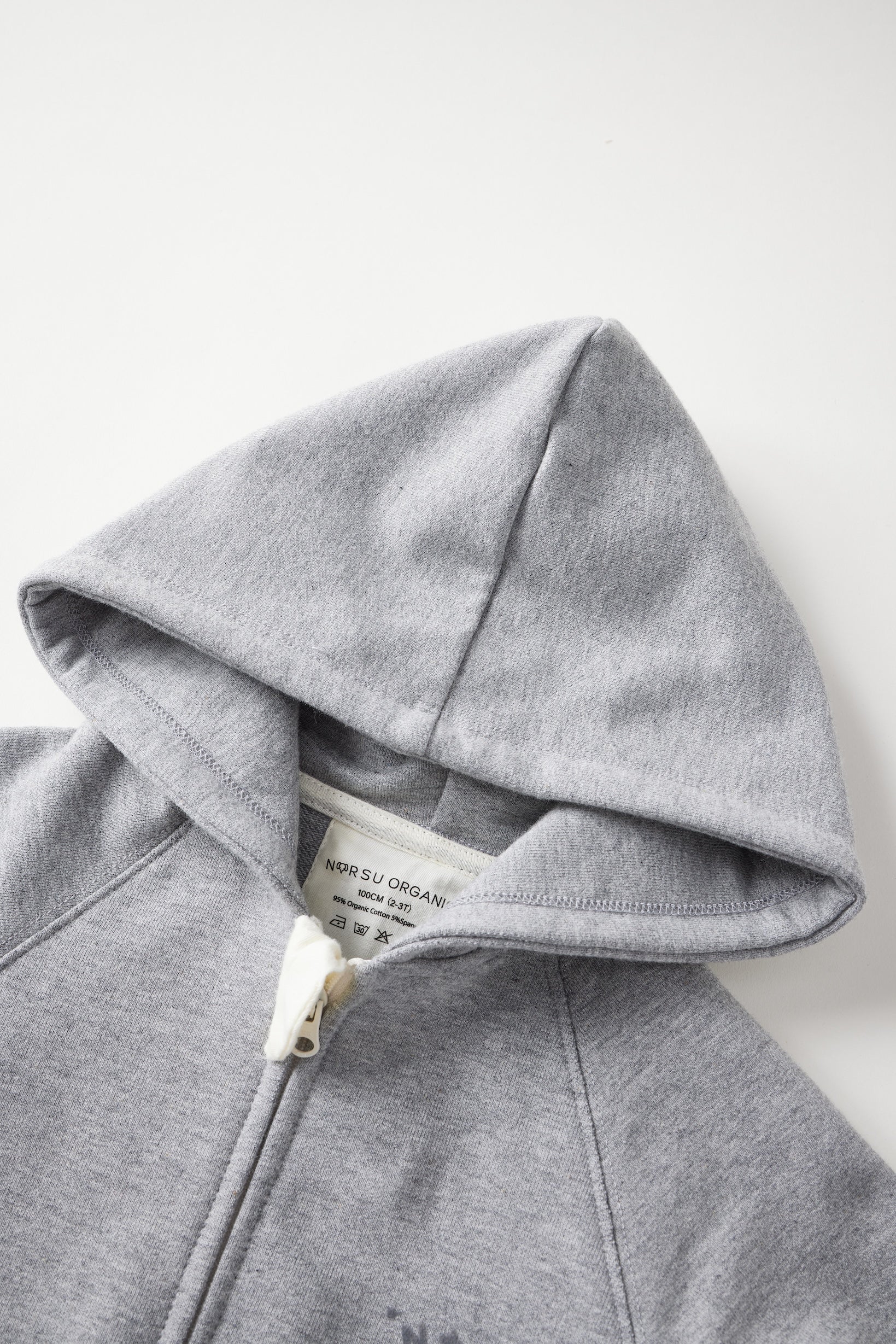Gray hoodie with a brand label on a white background