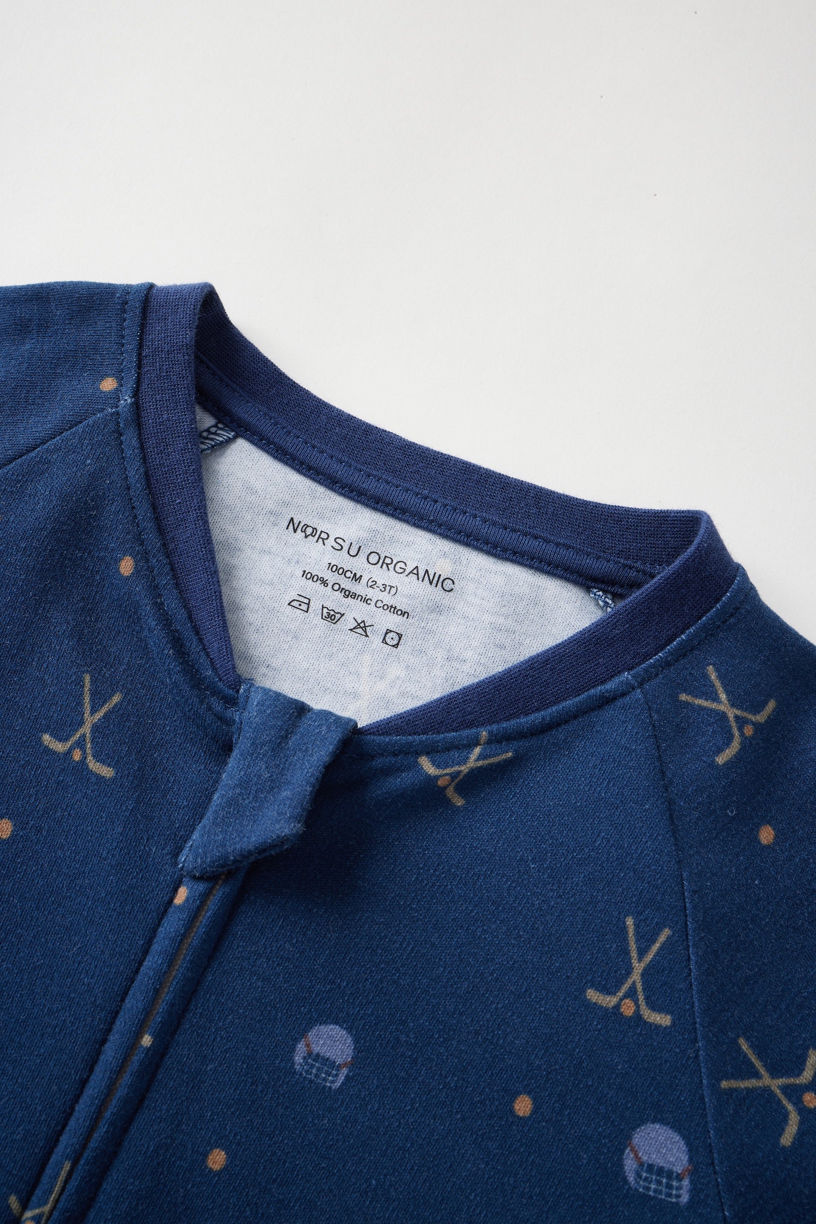 Navy blue garment with patterns on a white background