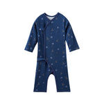 Navy blue baby sleeper with hockey pattern on a white background