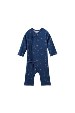Navy blue baby sleeper with hockey pattern on a white background