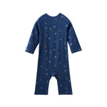 Navy blue baby sleeper with hockey pattern on a white background