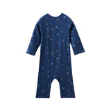 Navy blue baby sleeper with hockey pattern on a white background