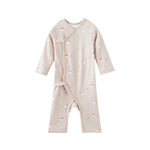 Baby onesie with polar bear pattern on a white background