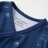 Close-up of a blue baby outfit with a label on a white background