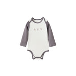 White baby onesie with gray sleeves on a white background