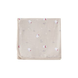 Beige blanket with red and white floral patterns on a white background