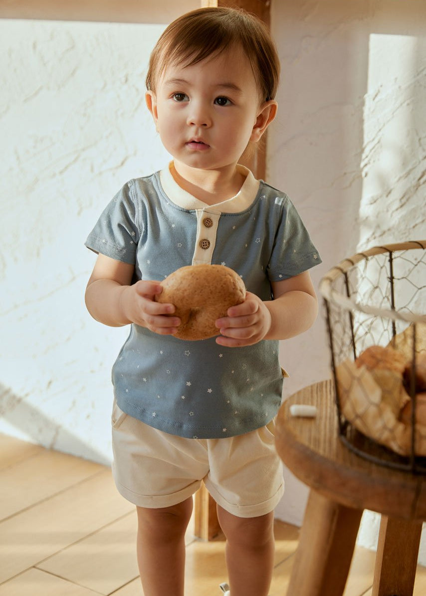 baby boy holding a begal