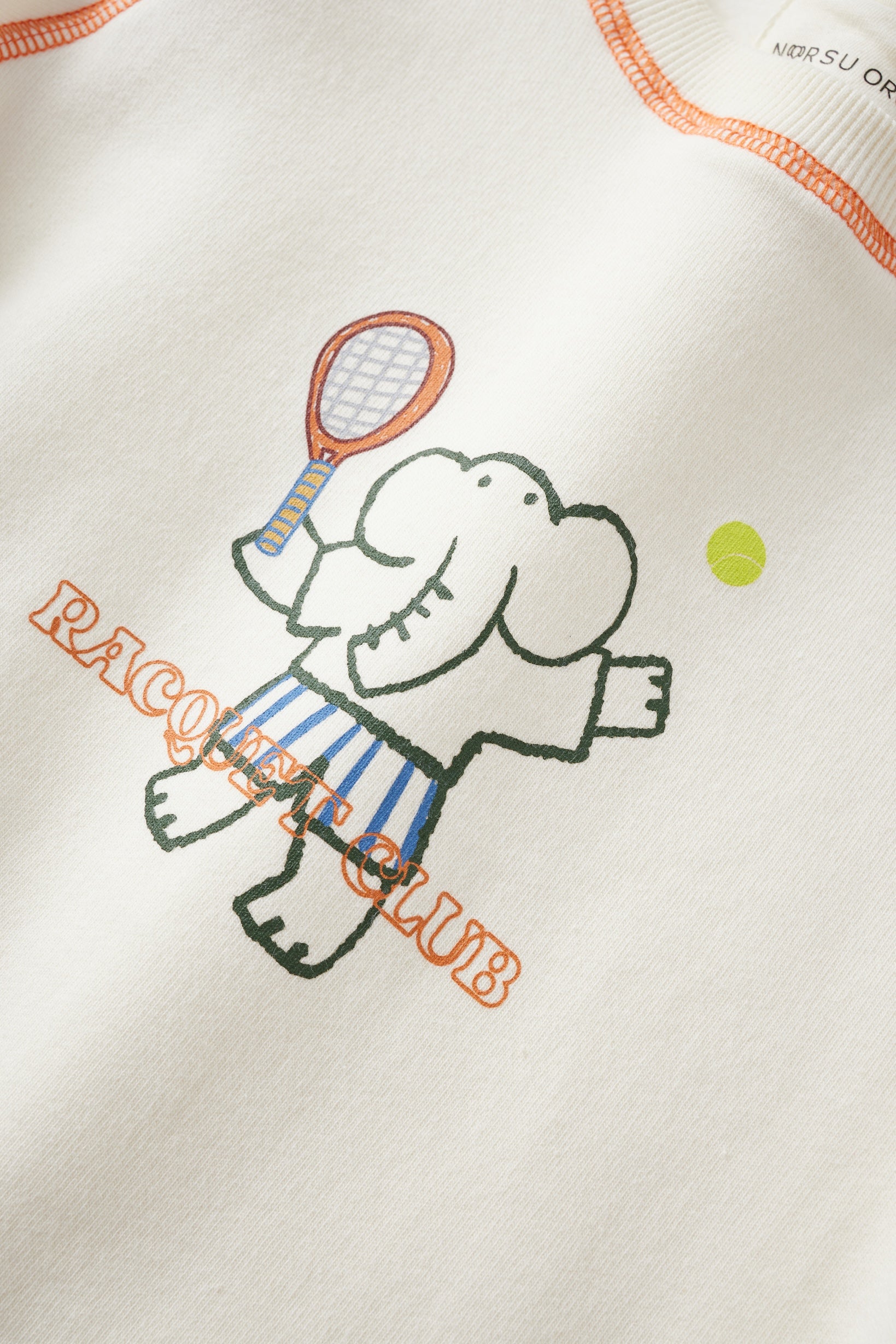 Embroidered design of a cartoon character holding a tennis racket and ball on a white background with 'Pacquay Club' text.