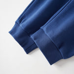 Close-up of a blue sweatpant on a white background