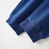 Close-up of a blue sweatpant on a white background