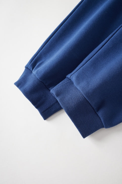 Close-up of a blue sweatpant on a white background