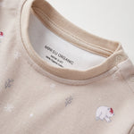 Beige baby outfit with bear illustrations and 'Norsu Organic' label on a white background