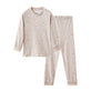 Beige pajama set with small patterns on a white background