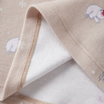 Close-up of a beige fabric with embroidered bear designs on a white background
