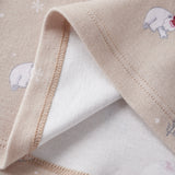 Close-up of a beige fabric with embroidered bear designs on a white background