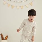 Model wearing Organic Toddler Pajama Set-Stary