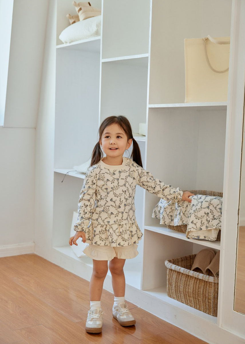 baby girl is standing 