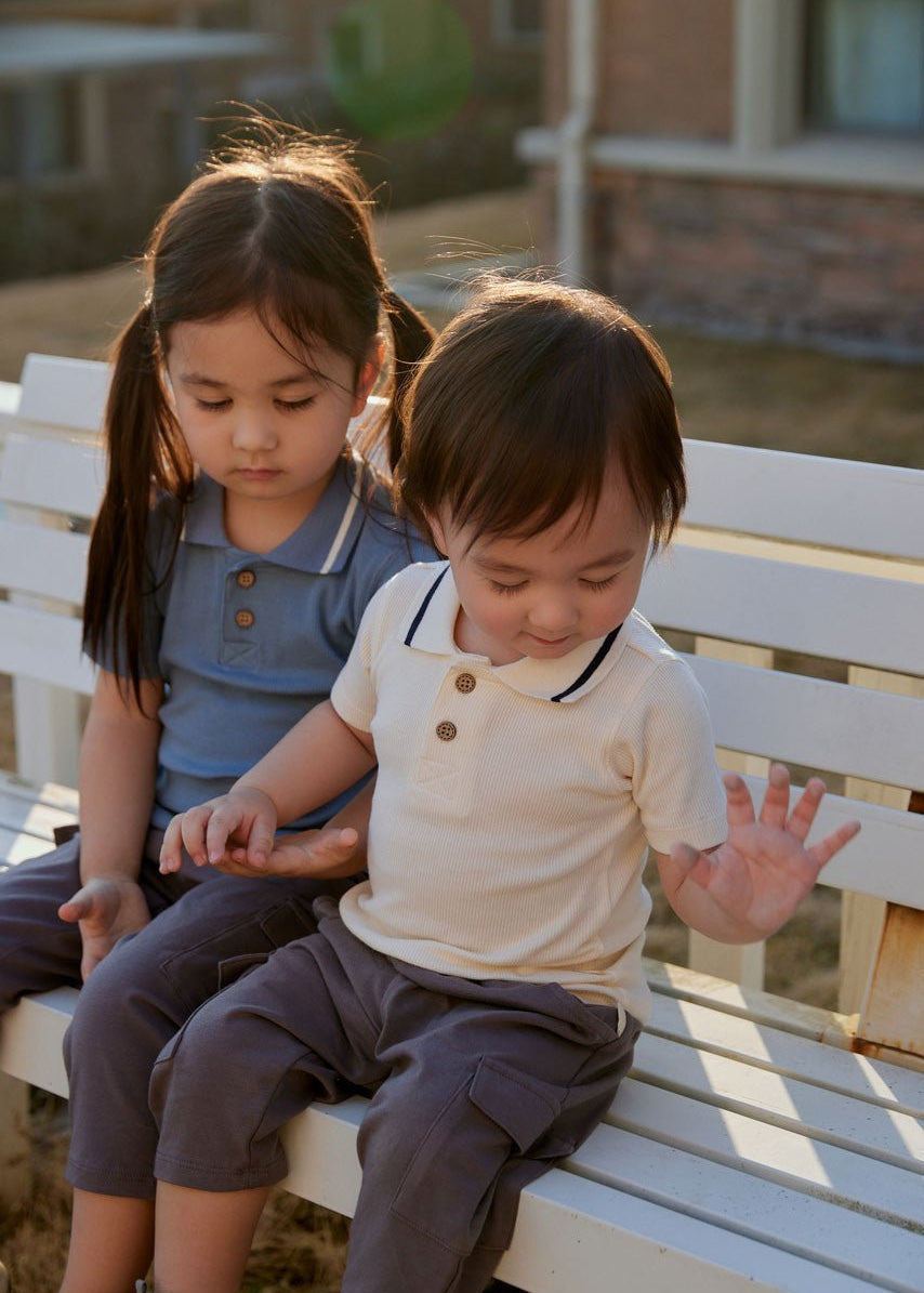 brother and sister sitting on the bench