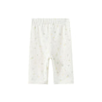 White baby pants with small patterns on a white background