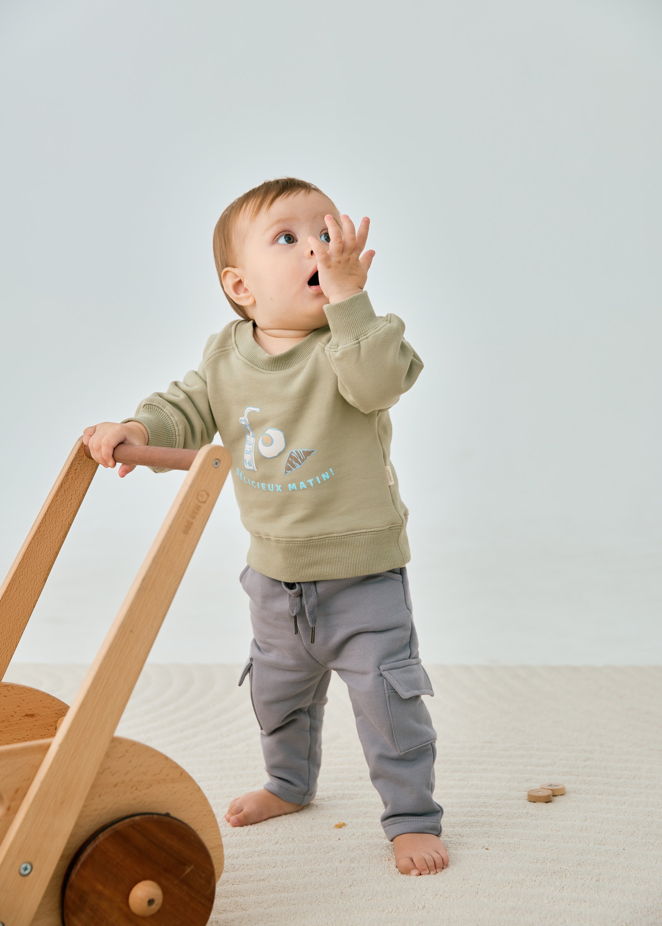 model wearing Organic Toddler Cargo Fleece Sweatpants-Grey