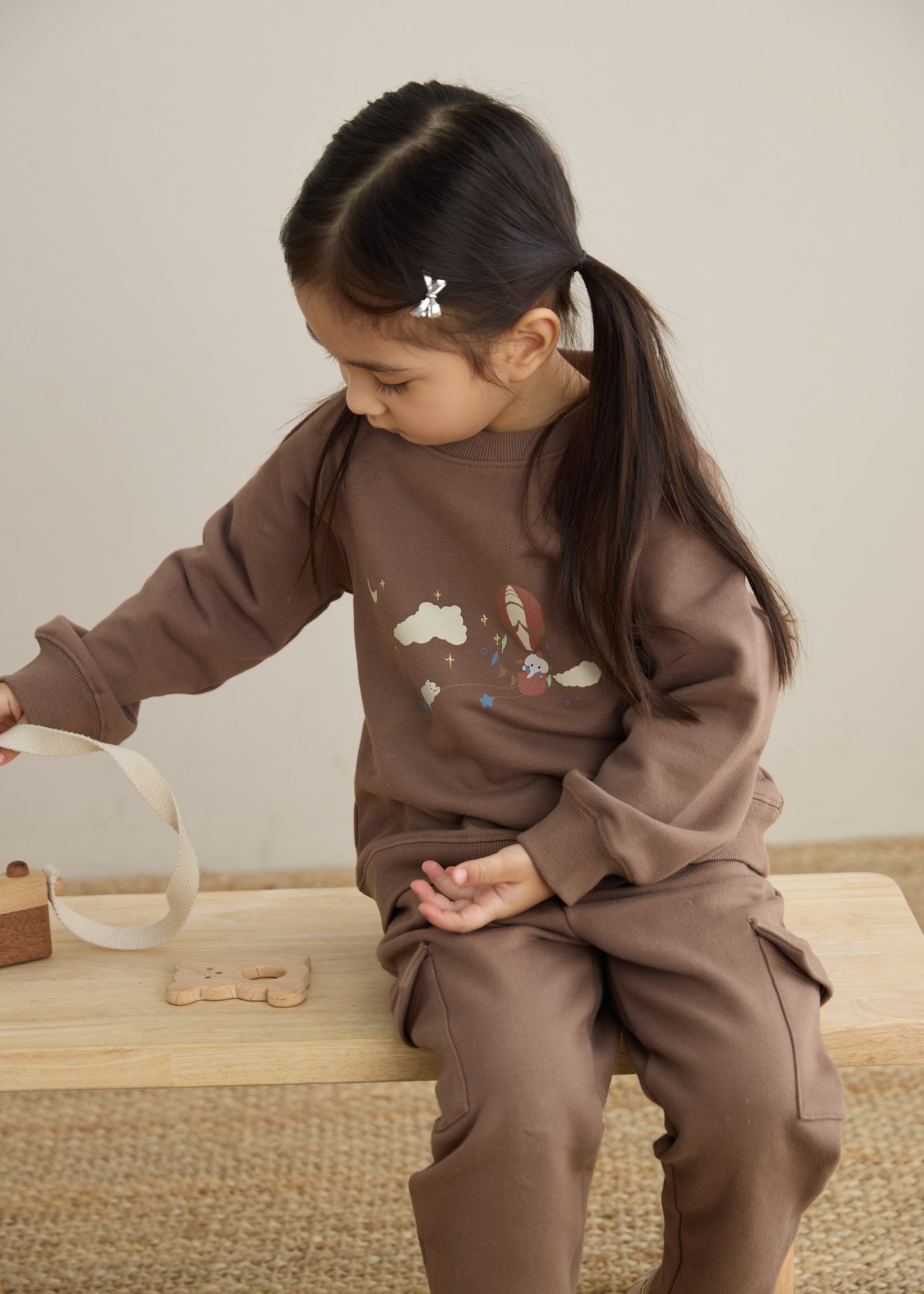 baby wearing Organic Toddler Cargo Fleece Sweatpants-Patridge and playing