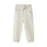 Beige sweatpants with a logo on a white background