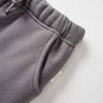 Gray sweatpants with drawstring on a light gray background