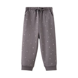 Gray sweatpants with small white patterns on a white background