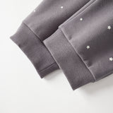 Gray sweatpant with star patterns on a white background