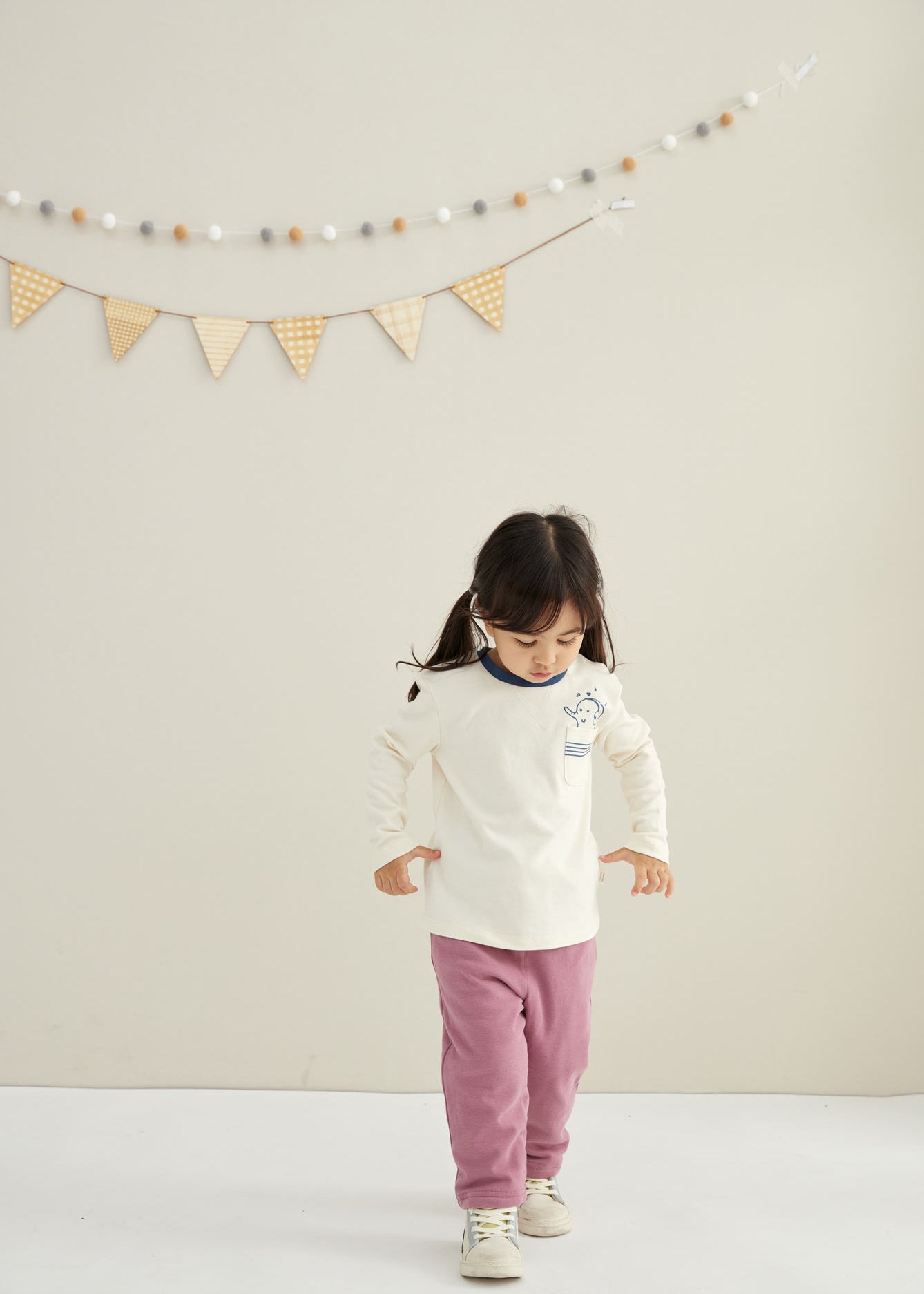 model walking and wearing Toddler Organic Cotton Quilted Pant-Heather