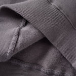 Close-up of a dark gray fabric with textured edge