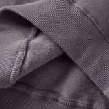 Close-up of a dark gray fabric with textured edge