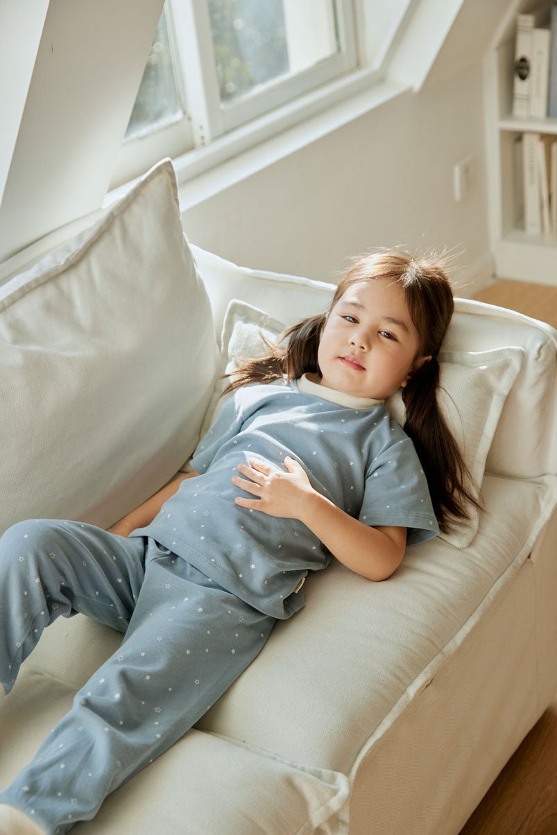 baby girl lie on the sofa