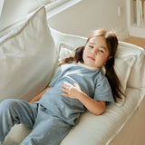 baby girl lie on the sofa