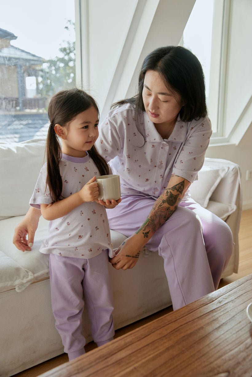mother and doctor sitting on the sofa