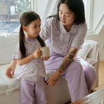 mother and doctor sitting on the sofa