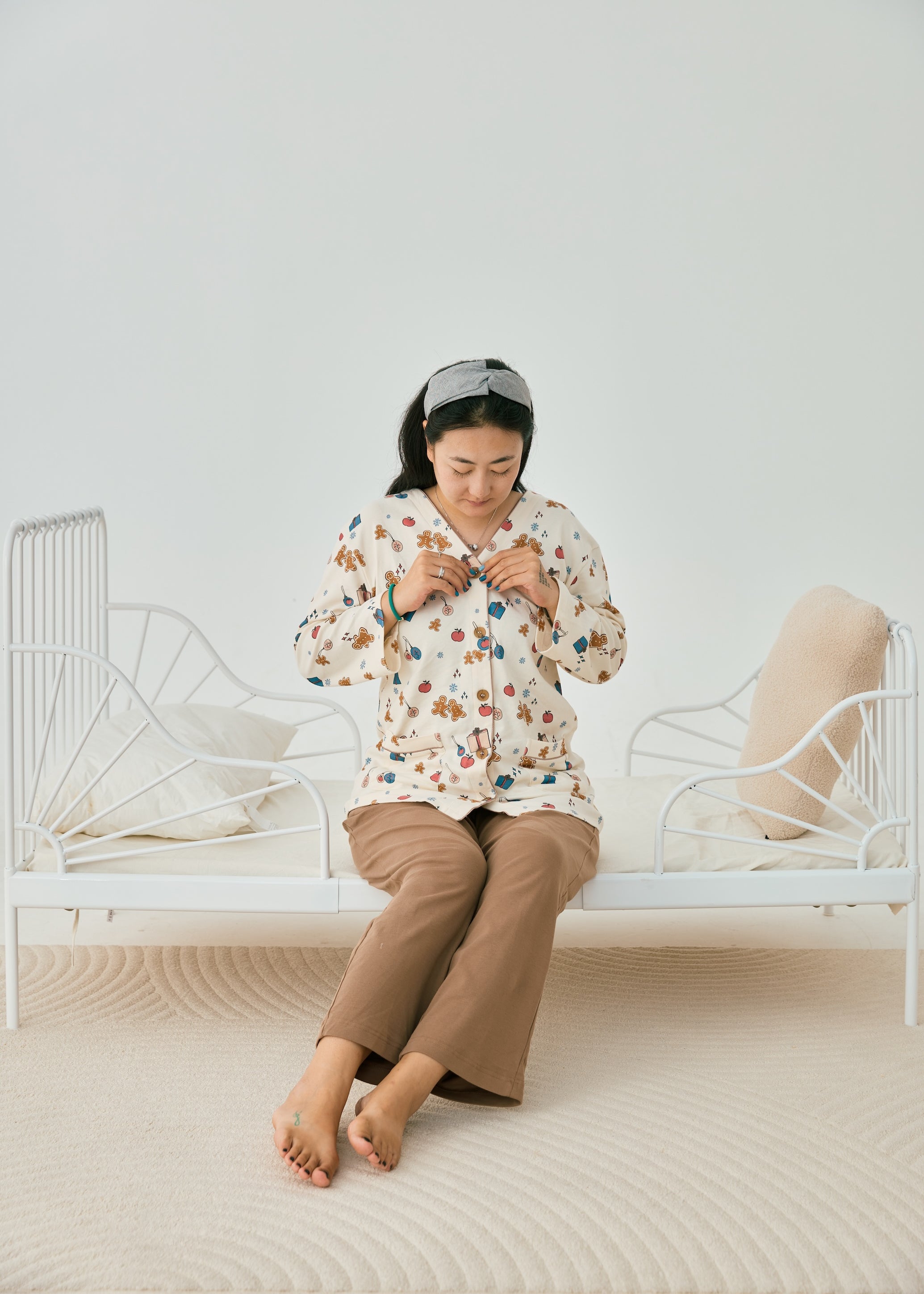 women sitting on the bed and wearing Women Organic 3/4 sleeve PJ Set-Holiday Joy