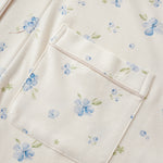 Floral patterned fabric with a pocket on a white background