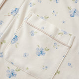 Floral patterned fabric with a pocket on a white background