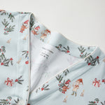 Light blue fabric with Christmas-themed pattern on a white background