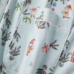 Light blue fabric with Christmas-themed gnome and jolly pattern