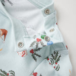 Light blue shirt with Christmas-themed pattern on a white background